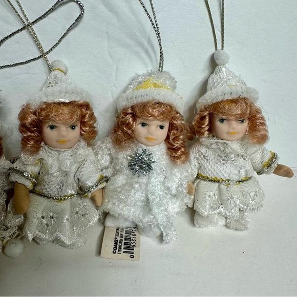 NWT. 7 porcelain doll ornaments. 5 of little girl and 2 of baby. - Picture 4 of 14